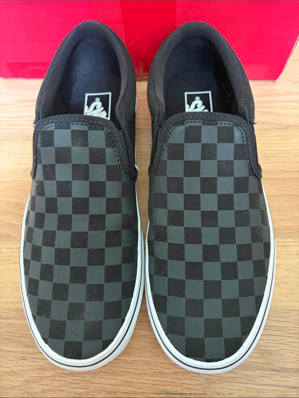 Vans Black Checkerboard Slip-On Sneakers